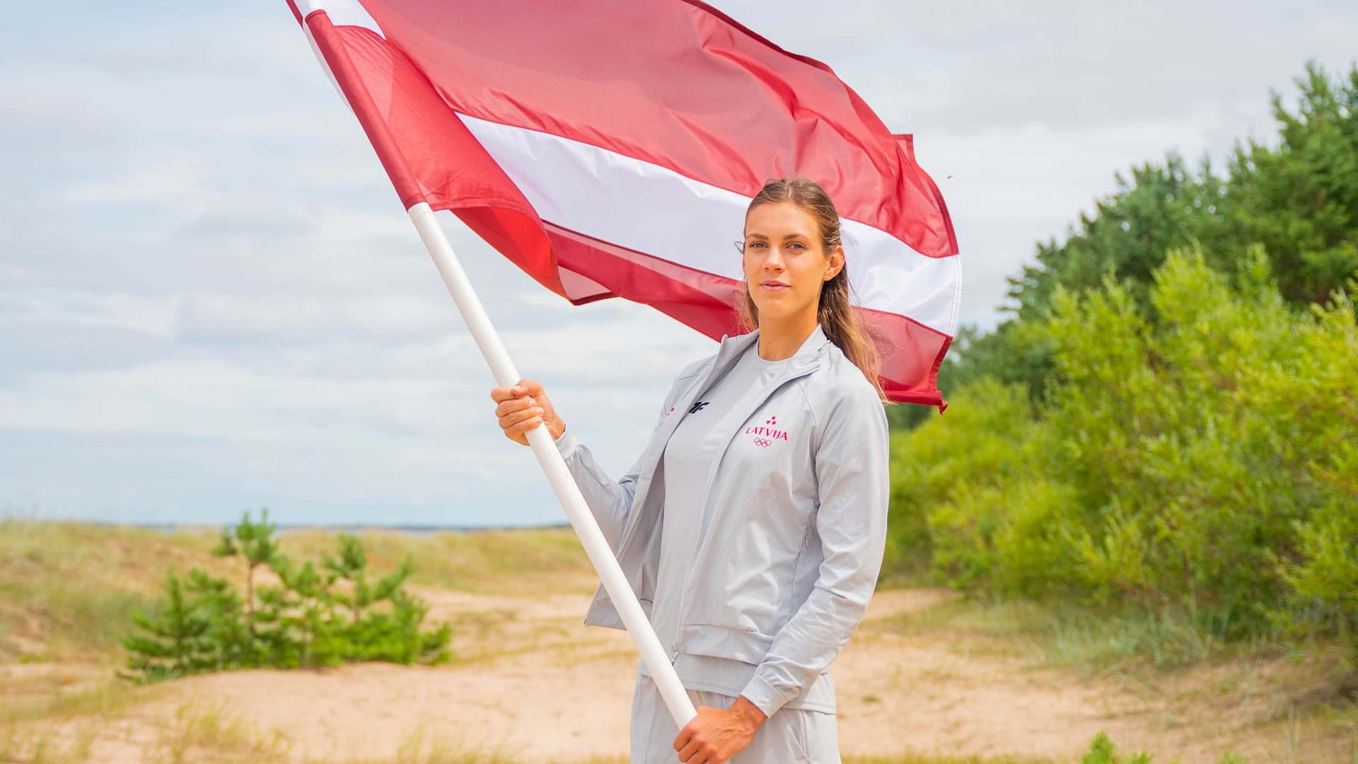 Latvian beach volleyball star Tina Graudina will carry her country's flag at the opening ceremony of the Olympic Games